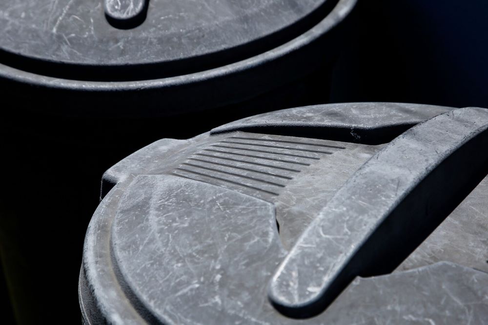 high angle closeup shot plastic garbage can sunlight